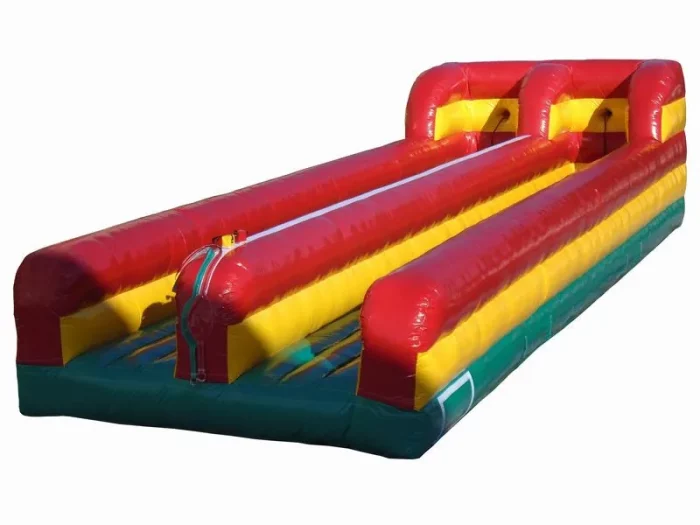 Dual-lane inflatable bungee run in red, yellow, and green. Perfect for fun events. Buy high-quality jumping castles online in Australia now!