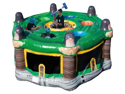 Whack-a-mole inflatable game with vibrant green and mole designs. Ideal for parties. Buy affordable jumping castles online in Australia today!