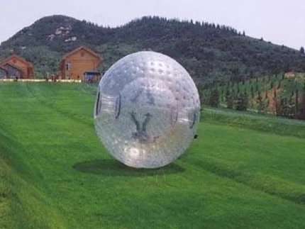 Zorb ball for outdoor fun, perfect for rolling on grass and slopes. Buy durable inflatable games online in Australia for events and activities!