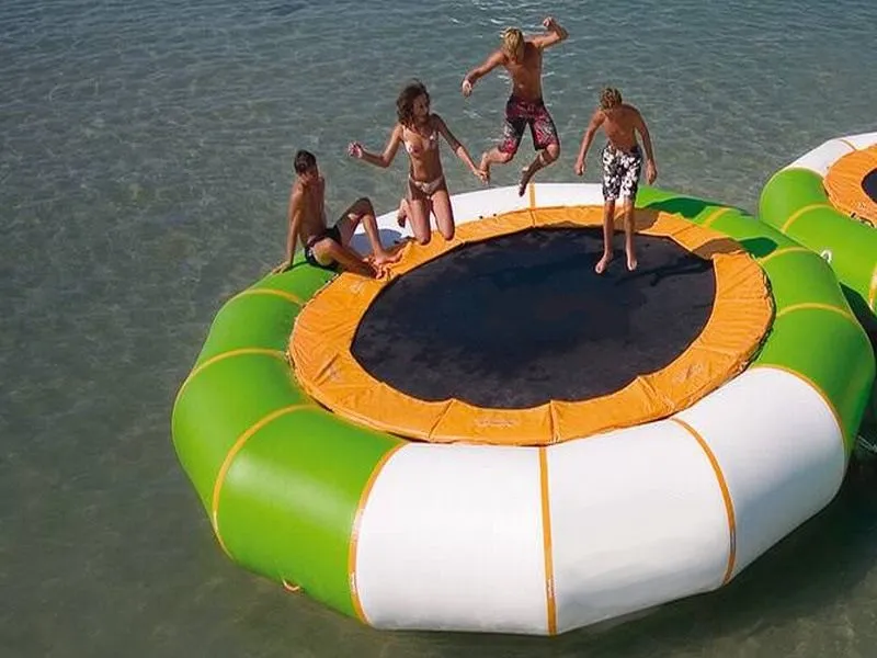 Inflatable water trampoline with green and white design, perfect for lakes and beach fun. Buy durable inflatables online in Australia today!