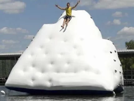 Inflatable iceberg climbing wall and slide for water fun. Perfect for lakes and parties. Buy durable water inflatables online in Australia today!