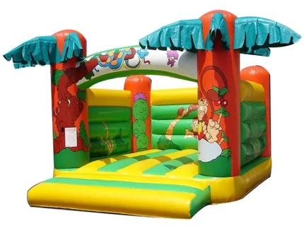 Jungle-themed inflatable jumping castle with palm tree designs, perfect for kids' parties. Fun and vibrant. Buy online in Australia today!