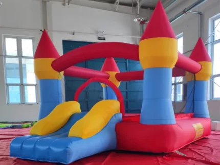 Colourful castle-themed jumping castle with slide, perfect for kids' parties. Fun and compact. Buy high-quality inflatables online in Australia today!