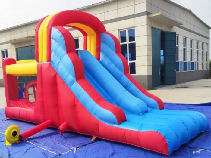 Inflatable slide with vibrant red and blue design, featuring a climbing area and play zone. Perfect for kids' events. Buy online in Australia today!